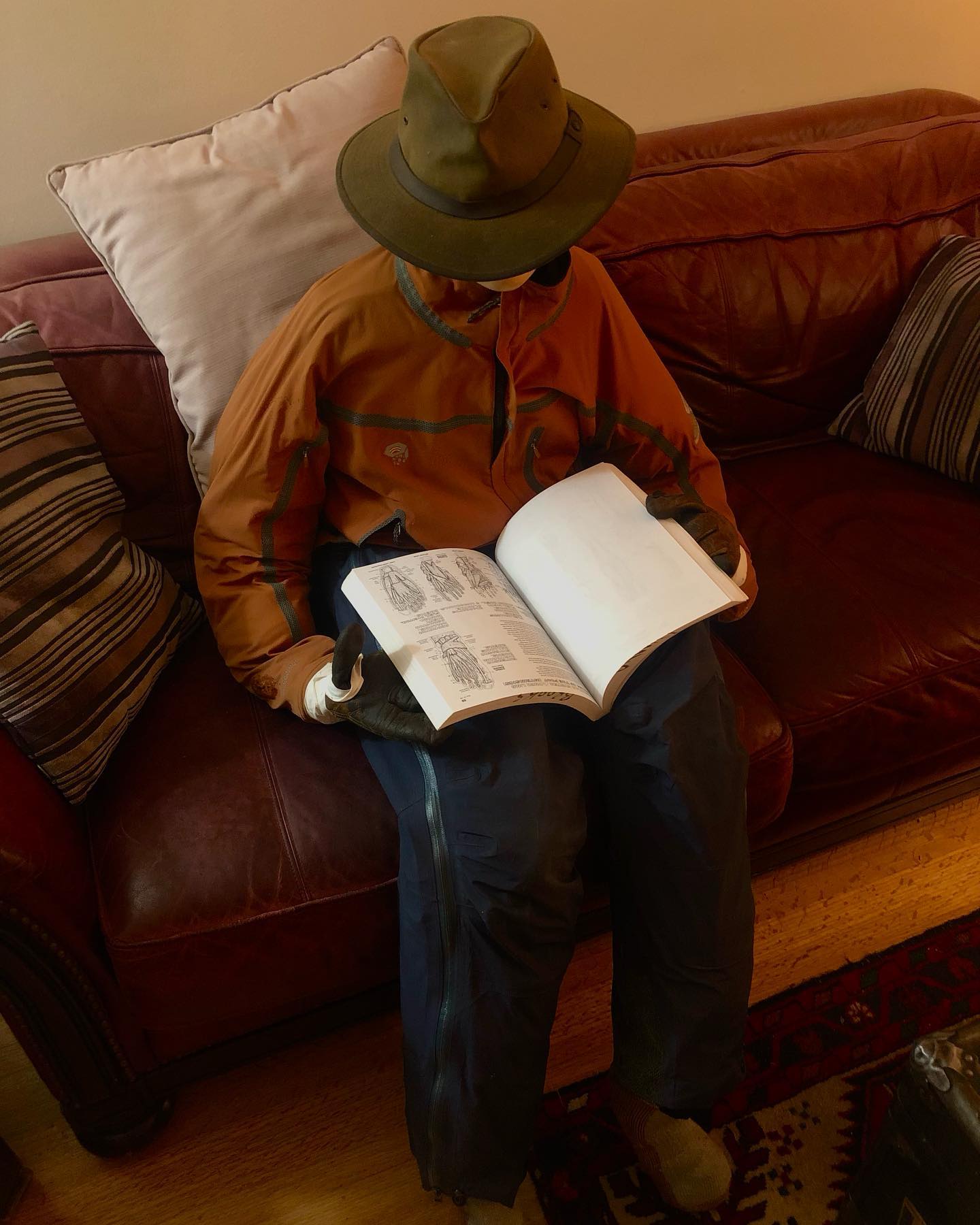 Scarecrow patient Jim studies Wilderness First Aid for the Virtual Workshop in the Advanced Outdoor First Responder.